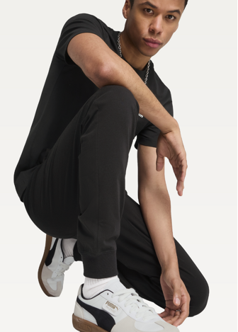 Штани спортивні чоловічі PUMA ESS No. 1 Logo Jersey Pants з манжетами чорного кольору