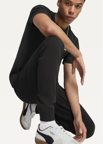 Штани спортивні чоловічі PUMA ESS No. 1 Logo Jersey Pants з манжетами чорного кольору