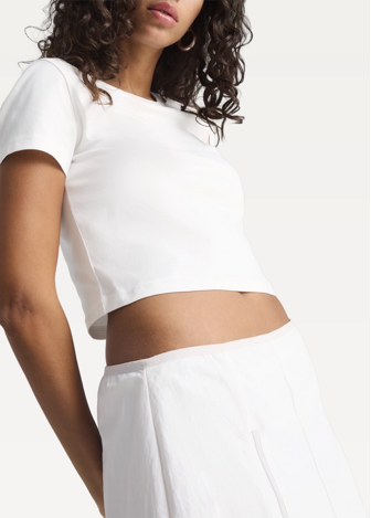 Футболка жіноча PUMA WARDROBE ESS Baby Tee білого кольору