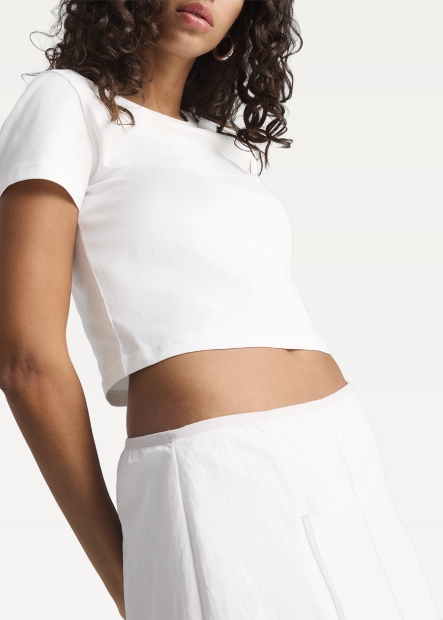 Футболка жіноча PUMA WARDROBE ESS Baby Tee білого кольору