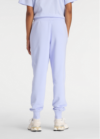 Штаны женские New Balance Sport French Terry Graphic Jogger лилового цвета