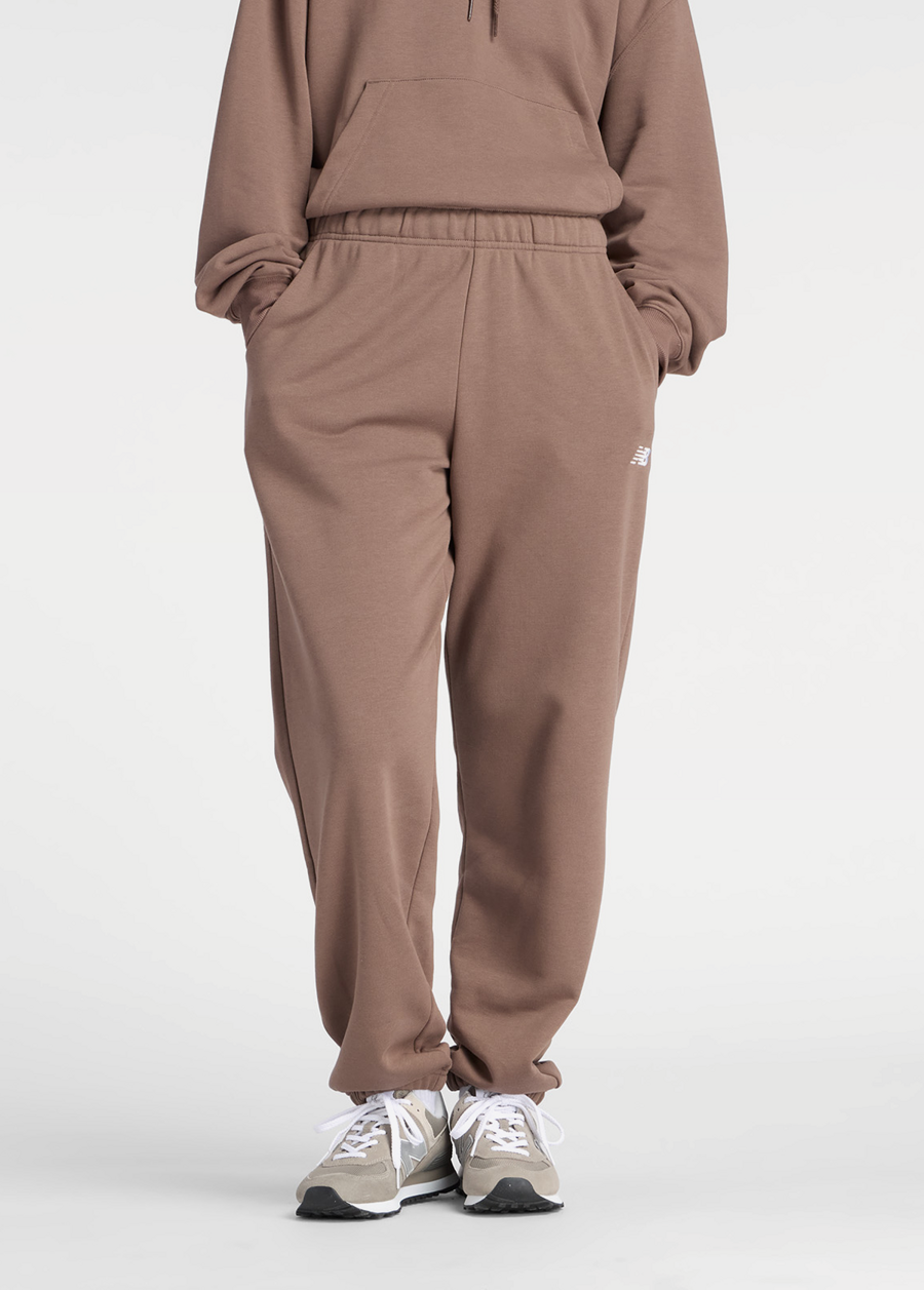 Штани жіночі New Balance Sport Essentials French Terry Jogger шоколадного кольору