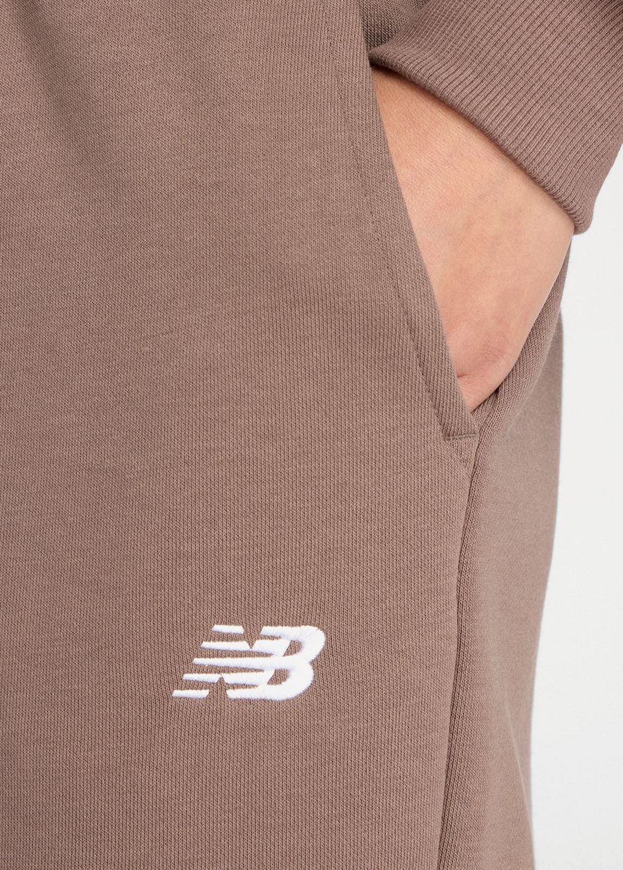 Штани жіночі New Balance Sport Essentials French Terry Jogger шоколадного кольору