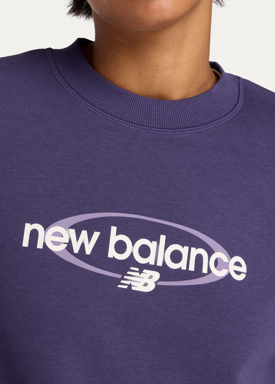 Світшот жіночий New Balance Sport Graphic Oversized Crew фіолетового кольору
