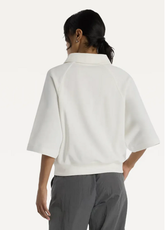 Футболка жіноча New Balance Coastal Fleece Oversized Polo бежевого кольору