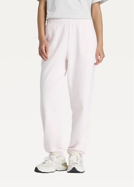 Штани жіночі New Balance Sport Essentials French Terry Jogger світло-рожевого кольору