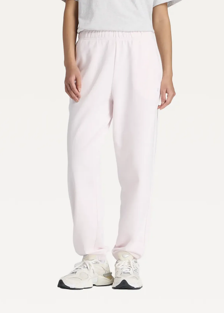 Штани жіночі New Balance Sport Essentials French Terry Jogger світло-рожевого кольору