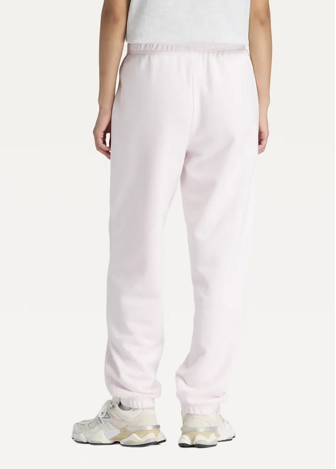 Штани жіночі New Balance Sport Essentials French Terry Jogger світло-рожевого кольору