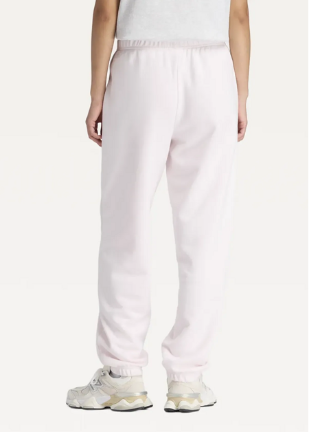 Штани жіночі New Balance Sport Essentials French Terry Jogger світло-рожевого кольору