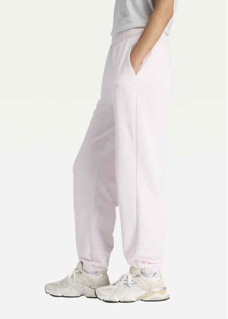 Штани жіночі New Balance Sport Essentials French Terry Jogger світло-рожевого кольору
