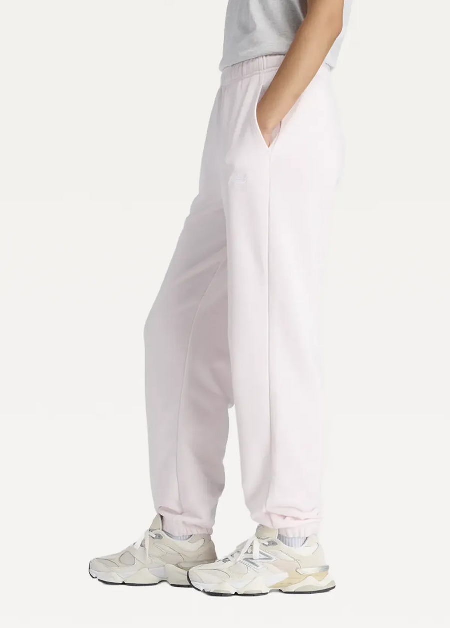 Штани жіночі New Balance Sport Essentials French Terry Jogger світло-рожевого кольору
