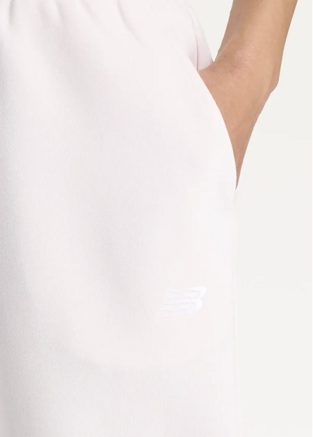Штани жіночі New Balance Sport Essentials French Terry Jogger світло-рожевого кольору