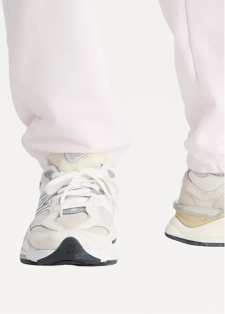 Штани жіночі New Balance Sport Essentials French Terry Jogger світло-рожевого кольору