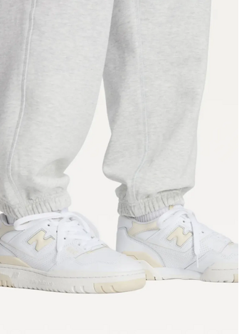 Спортивні штани жіночі New Balance Athletics French Terry світло-сірого кольору