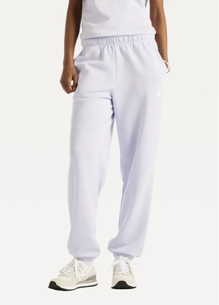 Штани жіночі New Balance Sport Essentials French Terry Jogger бузкового кольору
