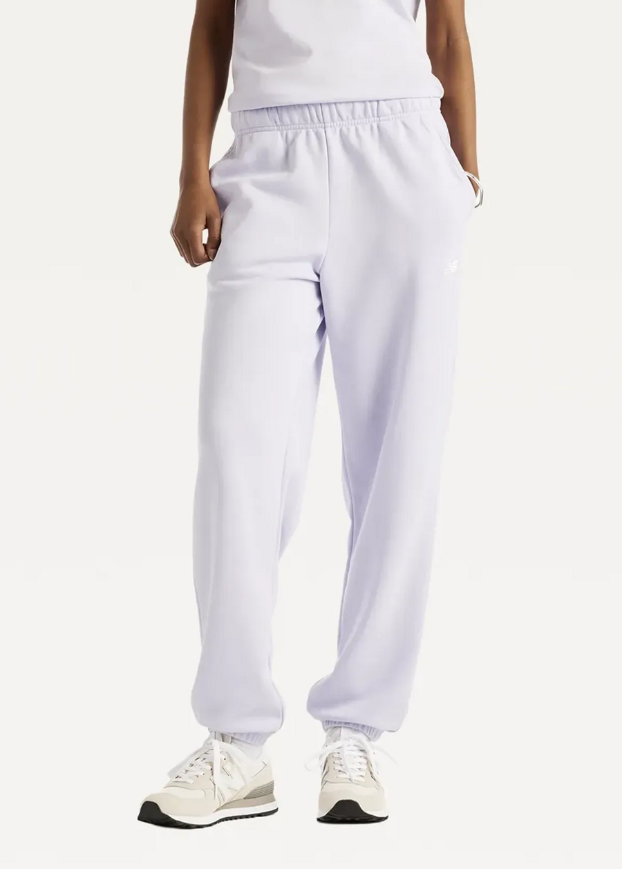 Штани жіночі New Balance Sport Essentials French Terry Jogger бузкового кольору