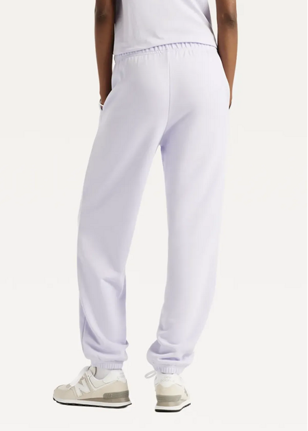 Штани жіночі New Balance Sport Essentials French Terry Jogger бузкового кольору