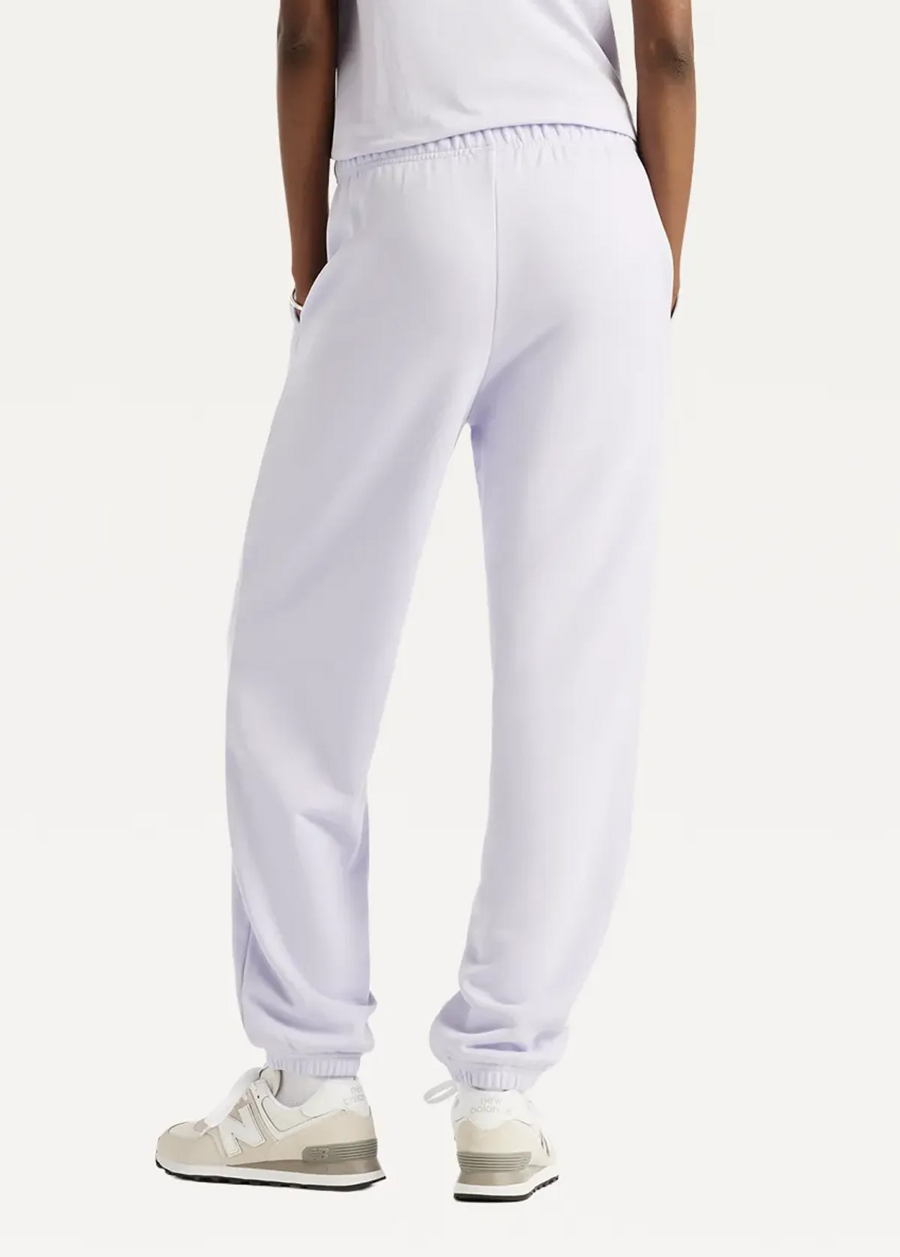 Штани жіночі New Balance Sport Essentials French Terry Jogger бузкового кольору