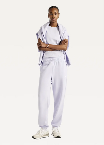 Штани жіночі New Balance Sport Essentials French Terry Jogger бузкового кольору