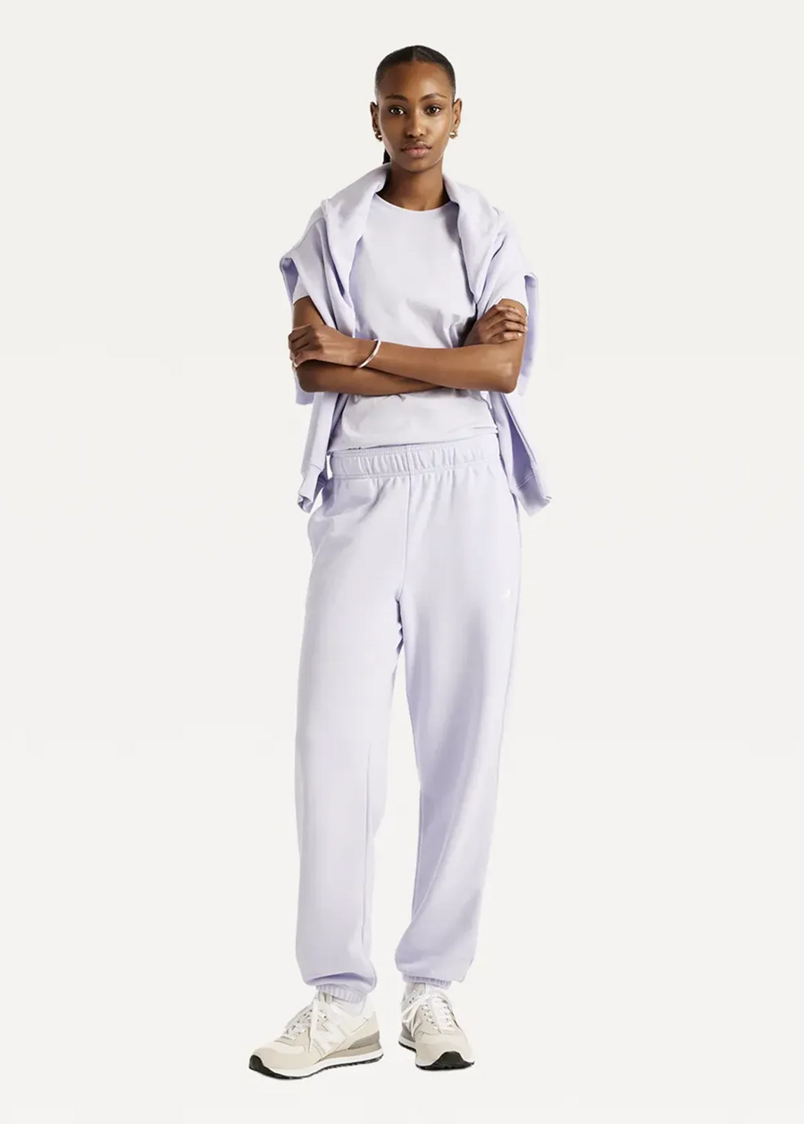 Штани жіночі New Balance Sport Essentials French Terry Jogger бузкового кольору