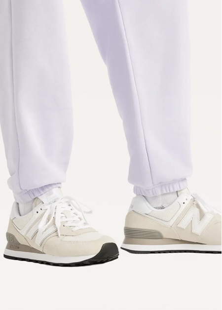 Штани жіночі New Balance Sport Essentials French Terry Jogger бузкового кольору