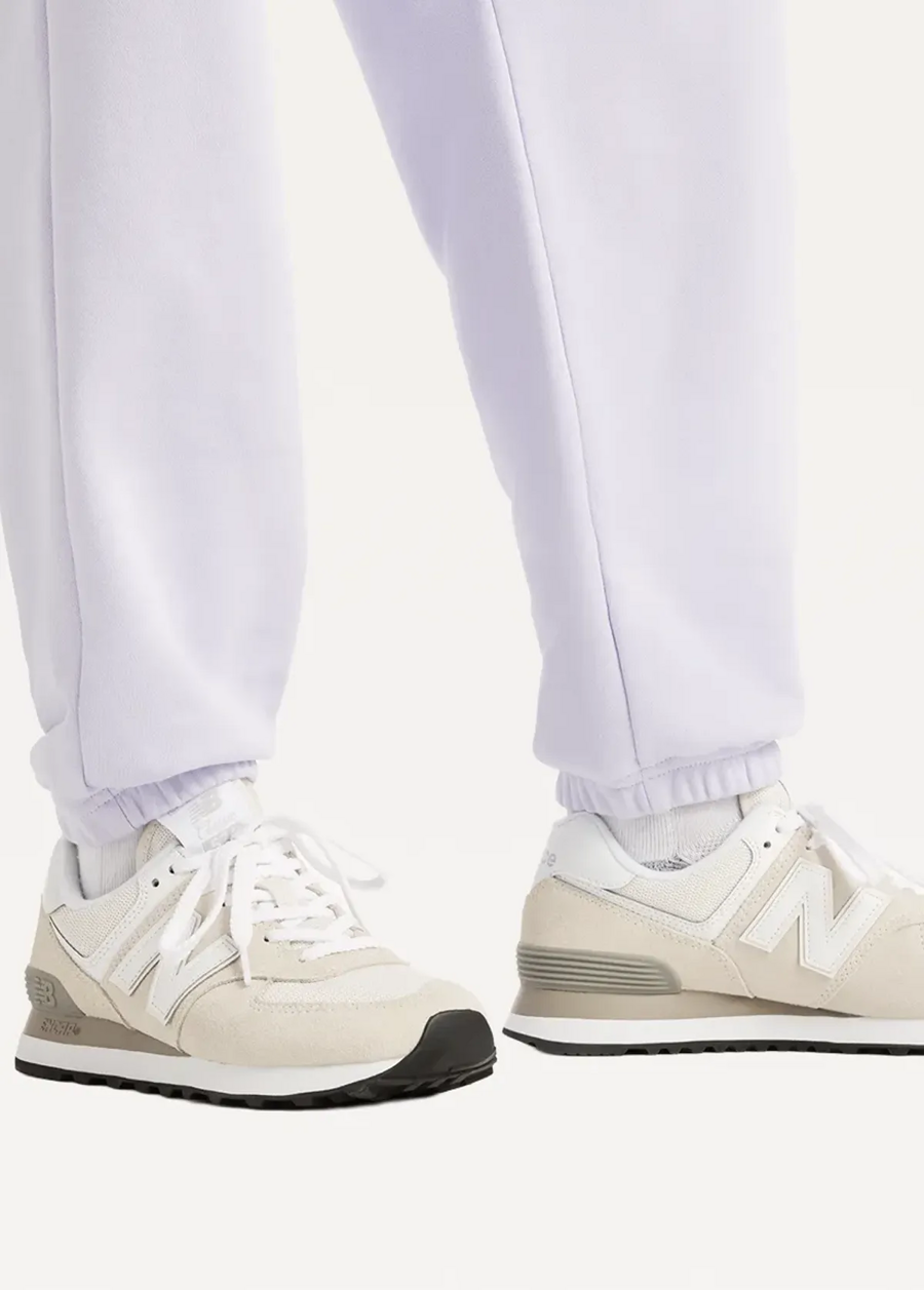 Штани жіночі New Balance Sport Essentials French Terry Jogger бузкового кольору