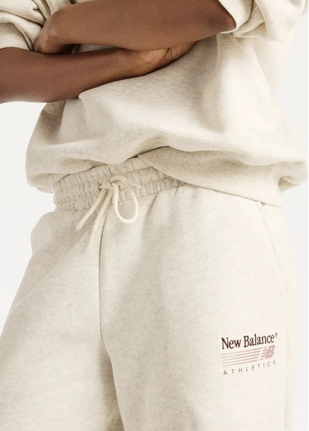 Штани жіночі New Balance Trackside Fleece бежевого кольору
