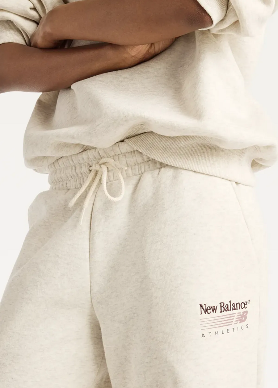 Штани жіночі New Balance Trackside Fleece бежевого кольору