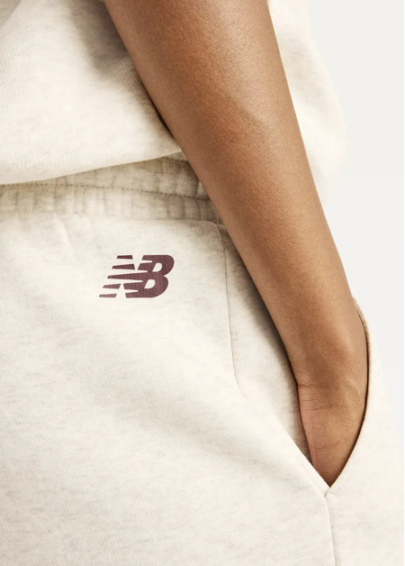 Штани жіночі New Balance Trackside Fleece бежевого кольору