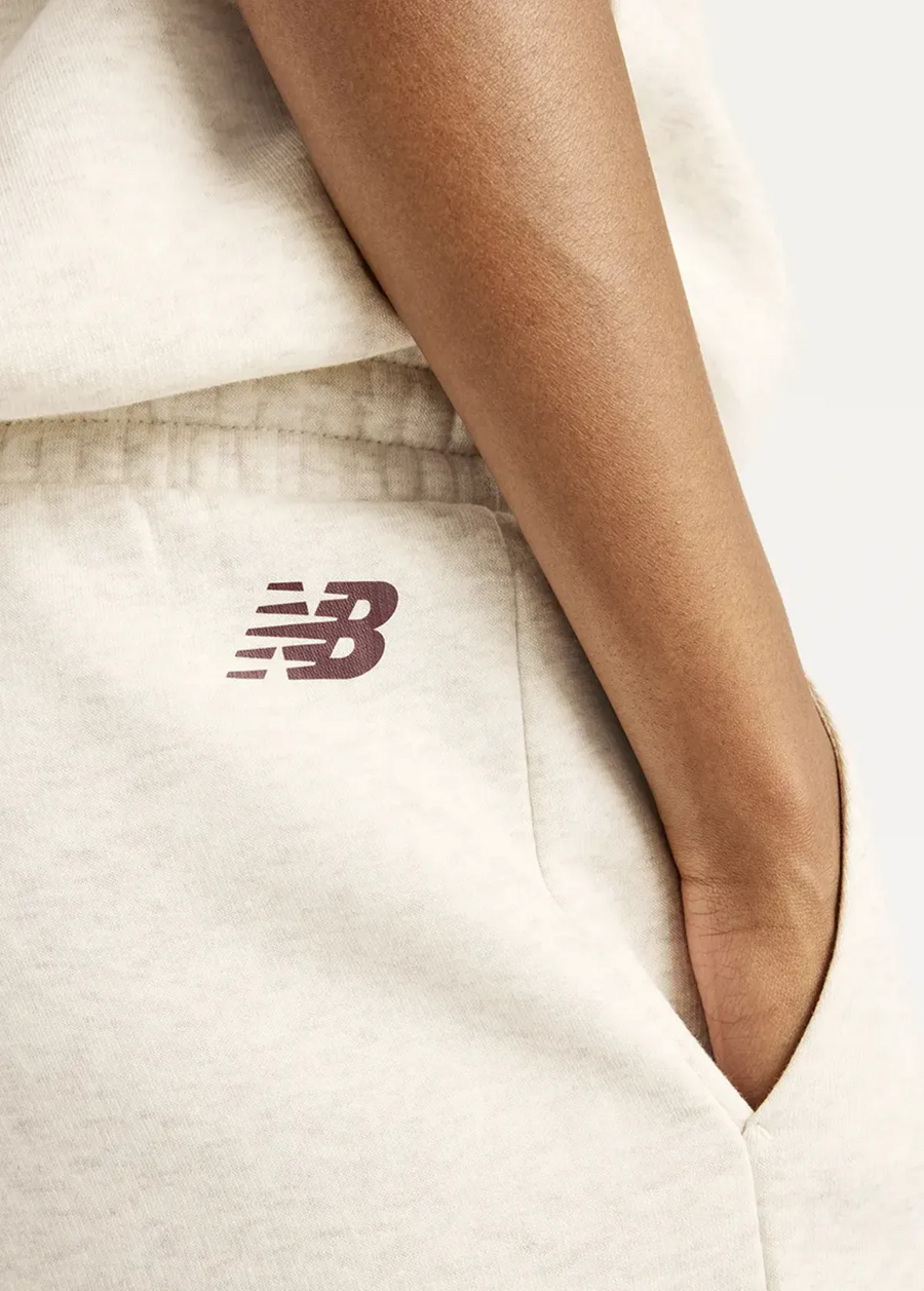 Штани жіночі New Balance Trackside Fleece бежевого кольору