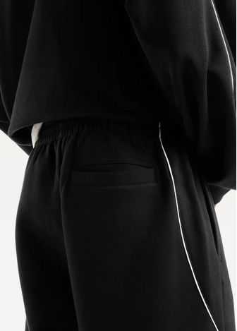 Штани чоловічі New Balance Trackside Fleece чорного кольору