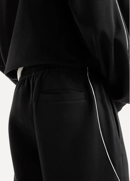 Штани чоловічі New Balance Trackside Fleece чорного кольору