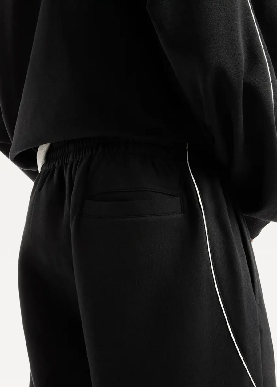 Штани чоловічі New Balance Trackside Fleece чорного кольору
