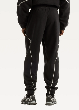 Штани чоловічі New Balance Trackside Polar Fleece чорного кольору