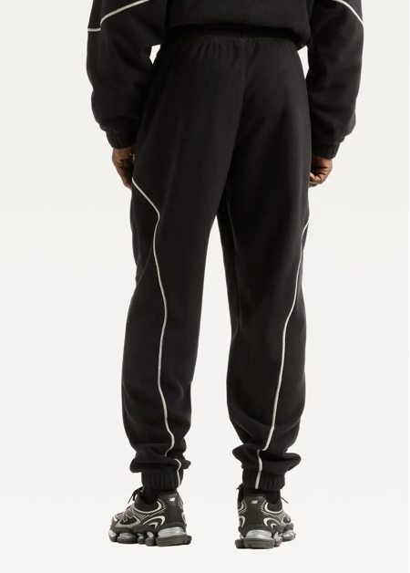 Штани чоловічі New Balance Trackside Polar Fleece чорного кольору