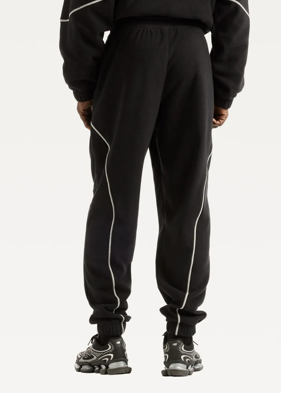 Штани чоловічі New Balance Trackside Polar Fleece чорного кольору