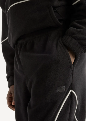 Штани чоловічі New Balance Trackside Polar Fleece чорного кольору