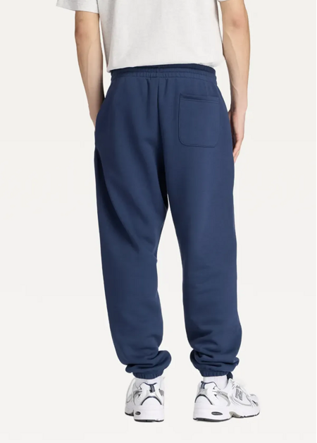 Штани чоловічі New Balance Sport Essentials Fleece синього кольору