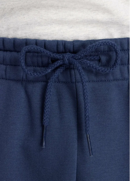 Штани чоловічі New Balance Sport Essentials Fleece синього кольору