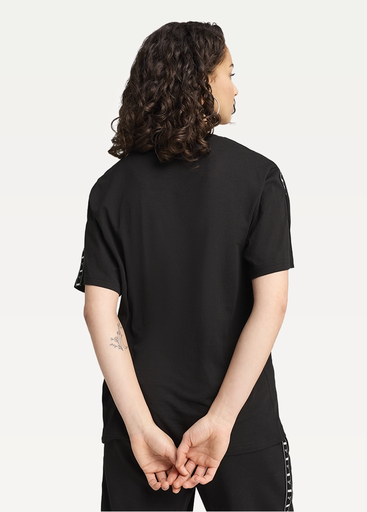 Футболка жіноча PUMA TAPE Relaxed Tee чорного кольору