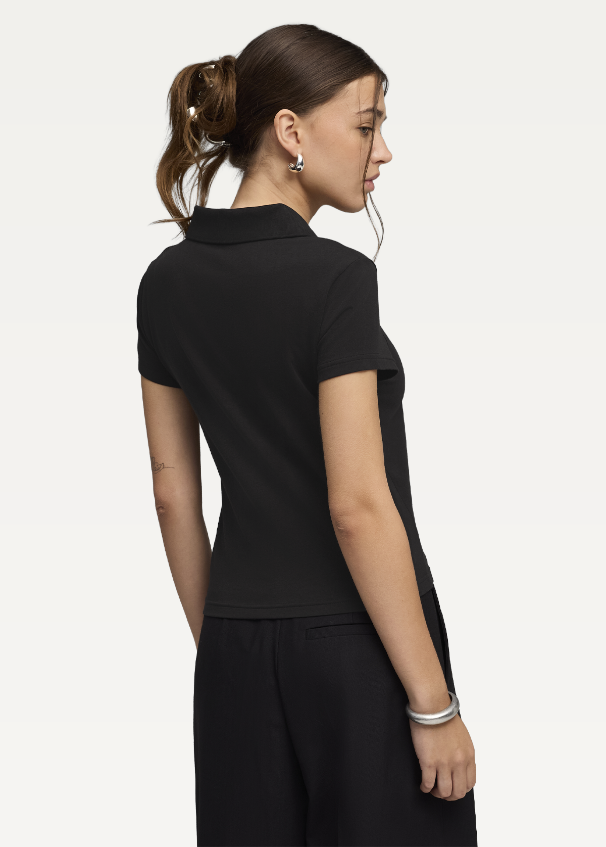 Поло жіноче PUMA ESS Baby Polo чорного кольору