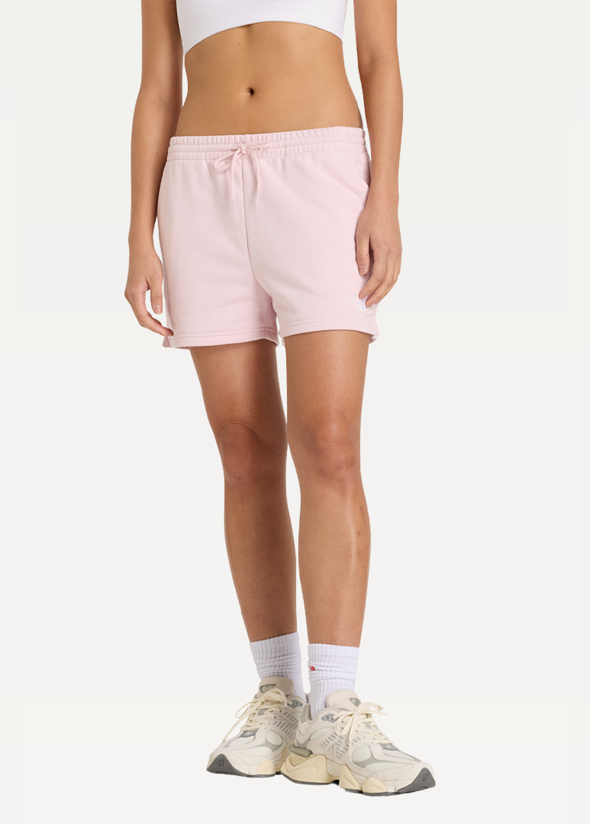 Шорты женские New Balance Sport Essentials FT розового цвета