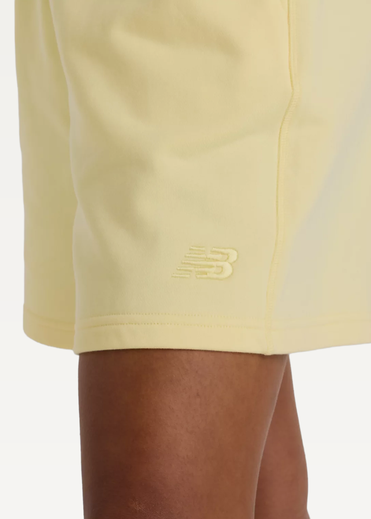 Шорты женские New Balance Athletics FT желтого цвета