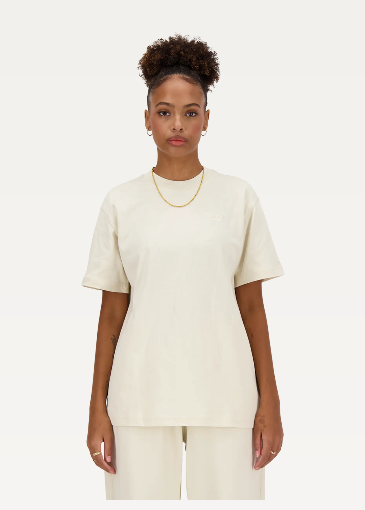 Футболка жіноча New Balance NB Athletics молочного кольору