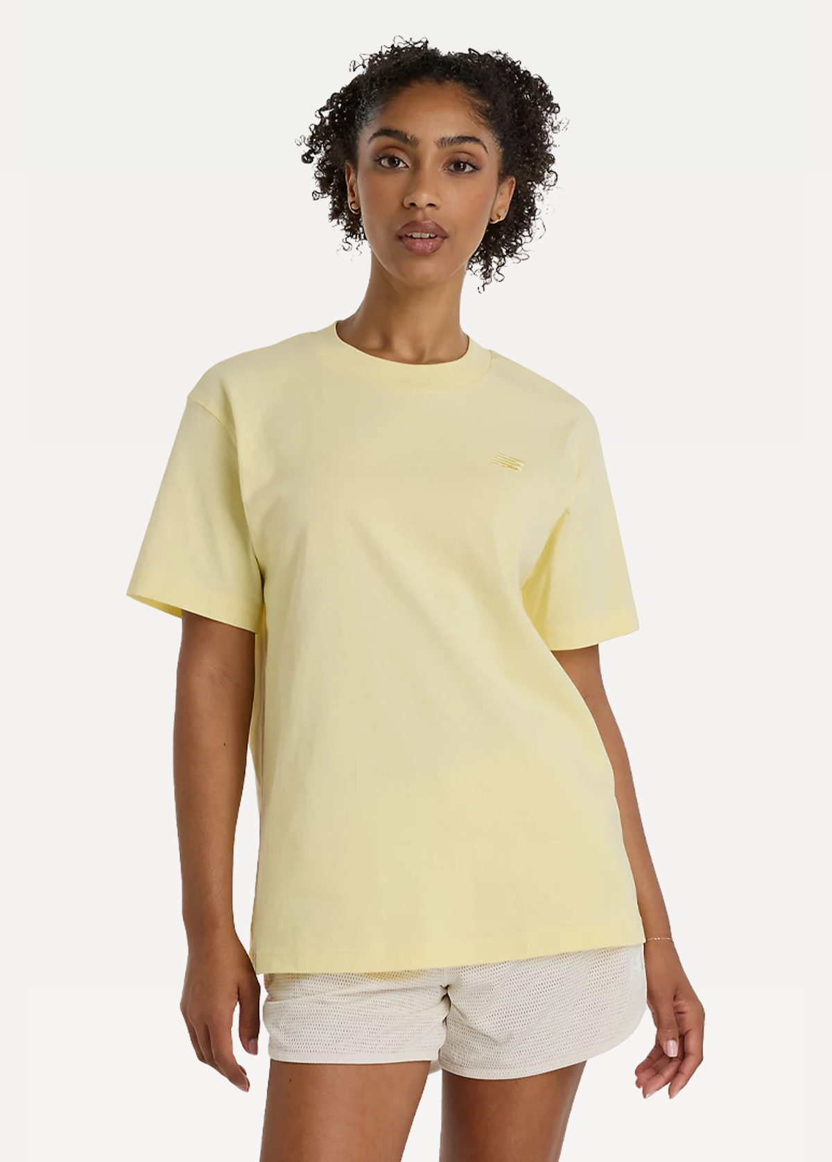 Футболка жіноча New Balance Athletics Jersey жовтого кольору