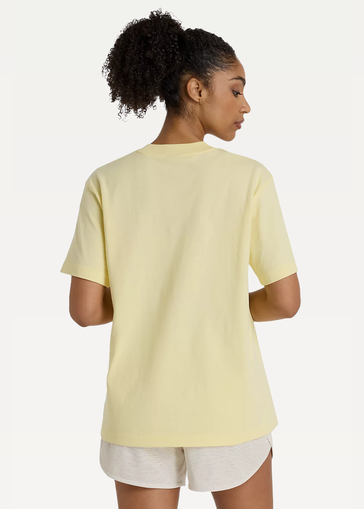 Футболка жіноча New Balance Athletics Jersey жовтого кольору