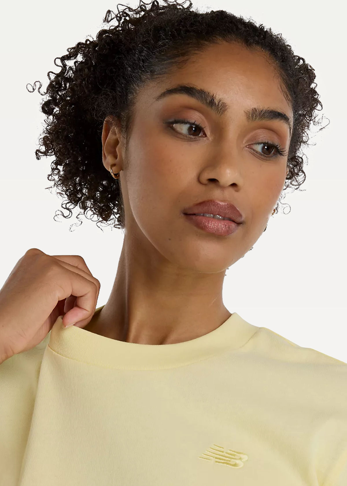 Футболка жіноча New Balance Athletics Jersey жовтого кольору