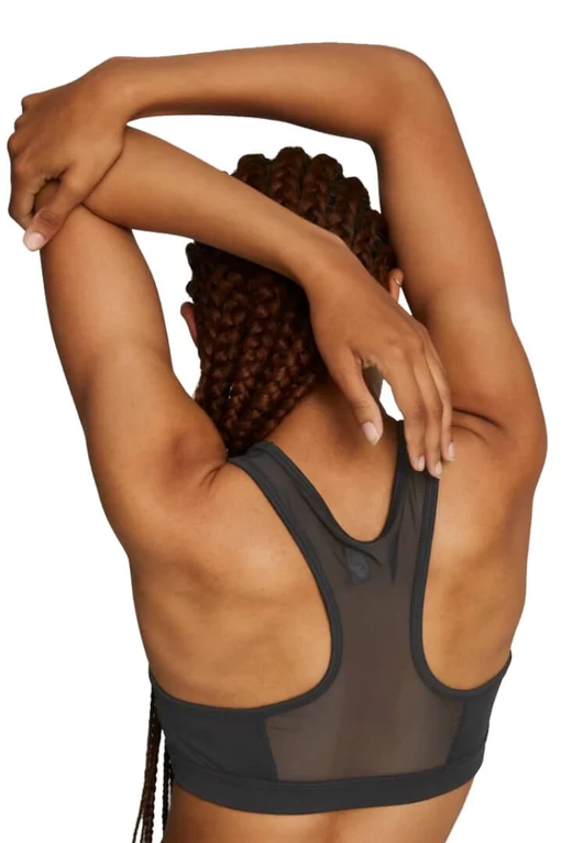 Бра женское Puma Mid Impact 4Keeps Bra черного цвета
