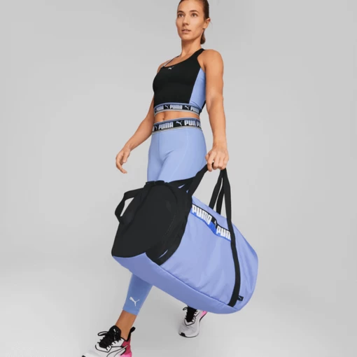 Сумка жіноча Puma AT ESS Barrel Bag лілового кольору